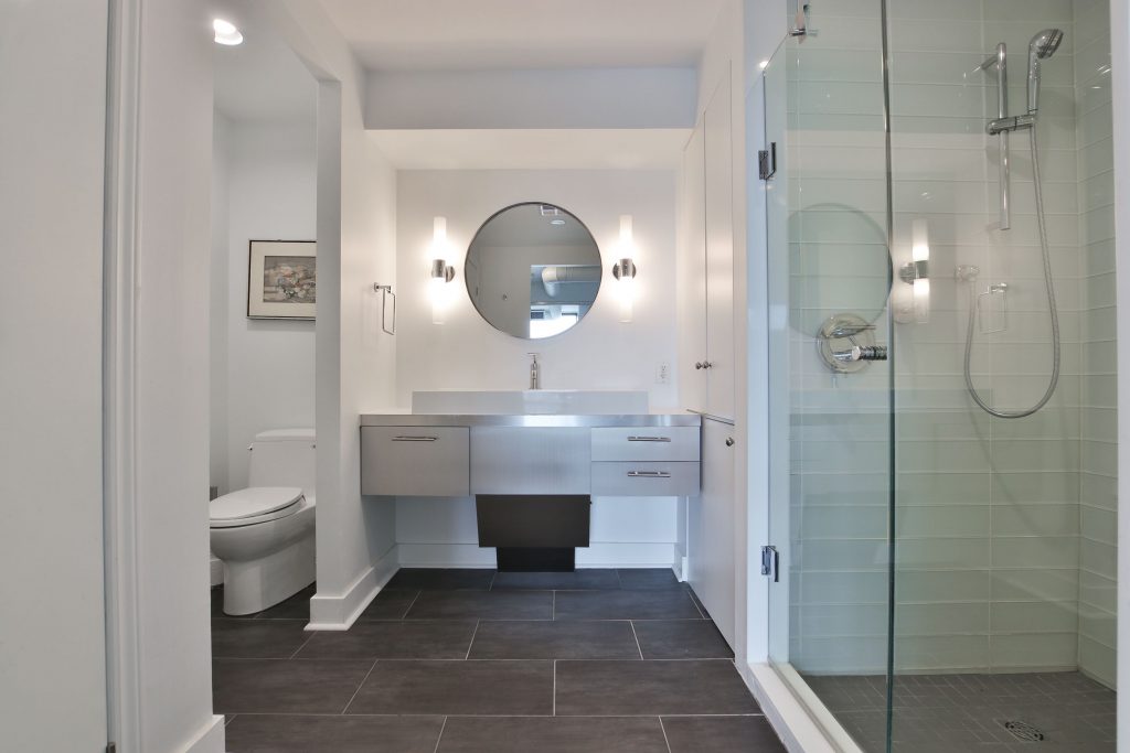 condo bathroom with steel vanity and walk in shower - condo bathroom renovations toronto